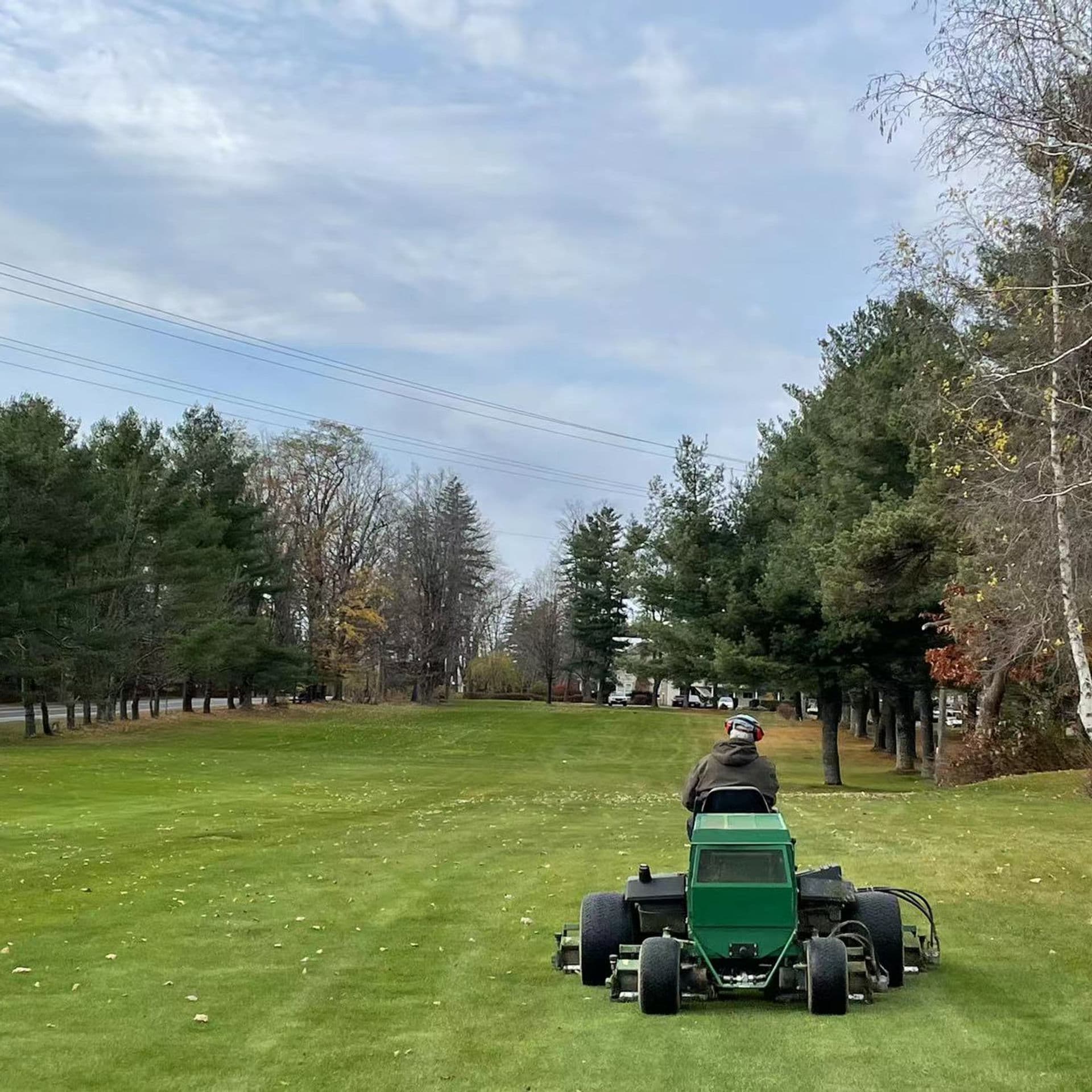 Golf course green with scenic mountain backdrop